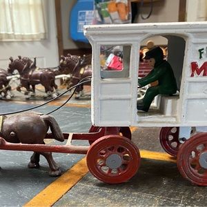 Cast iron milk wagon with one horse